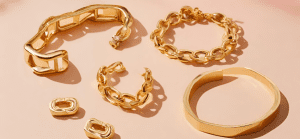 Showcase a modern piece of gold jewelry inspired by 90s trends.