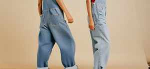 an image of a fashion-forward individual rocking a pair of stylish baggy jeans or overalls with a caption highlighting the comeback of these iconic styles.
